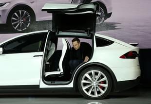 Tesla CEO Elon Musk steps out of the new Tesla Model X during an event to launch the company’s new crossover SUV on September 29, 2015 in Fremont, California. (Justin Sullivan/Getty Images)
